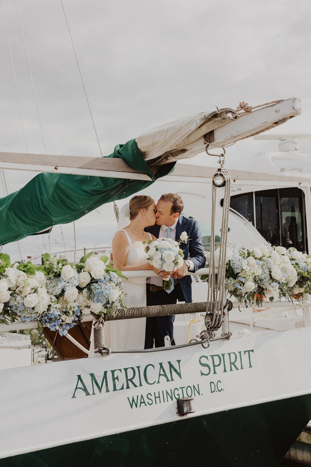 couple kiss during boat wedding on the American Spirit