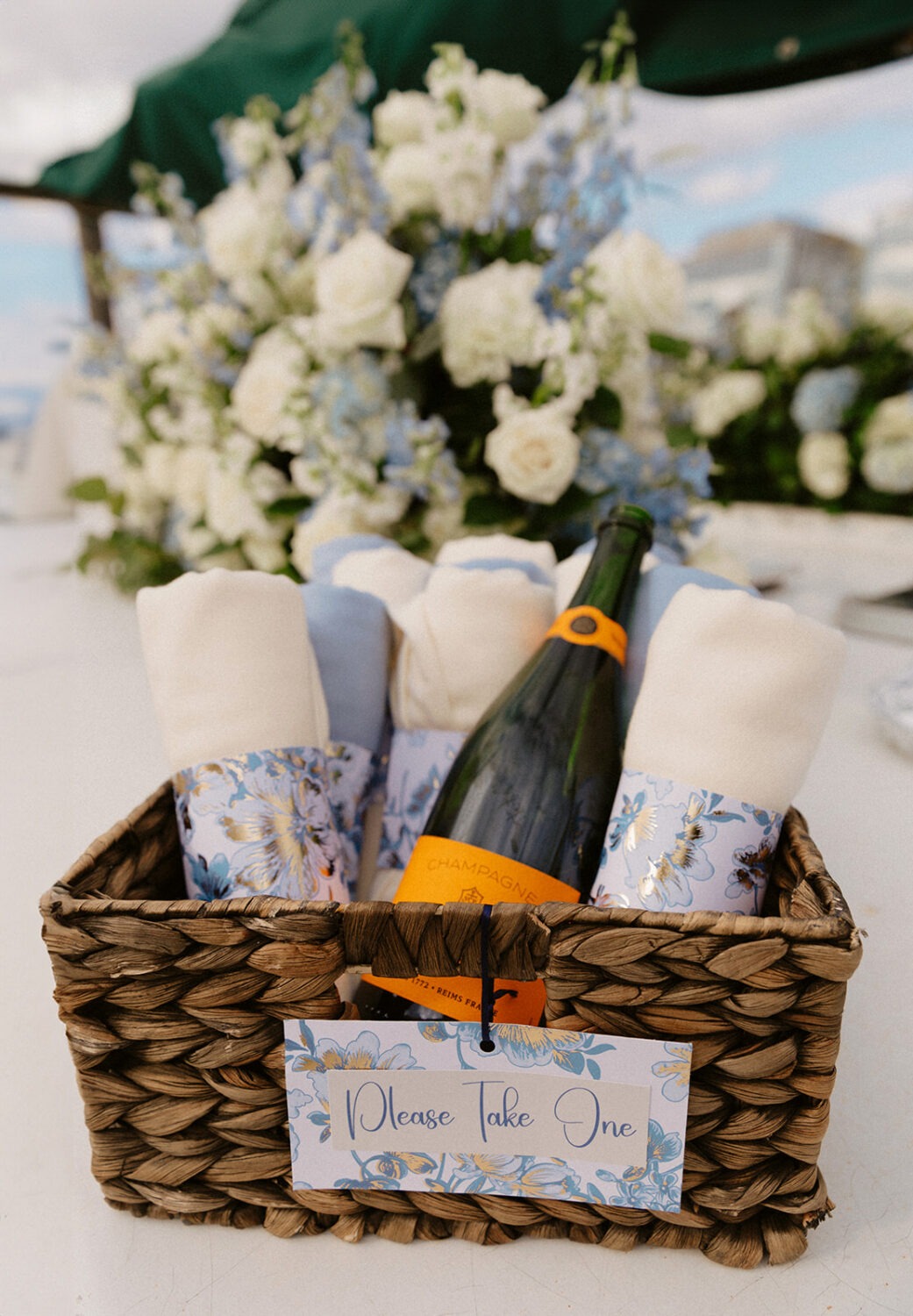 detail shot of champagne and blankets for guest on boat wedding