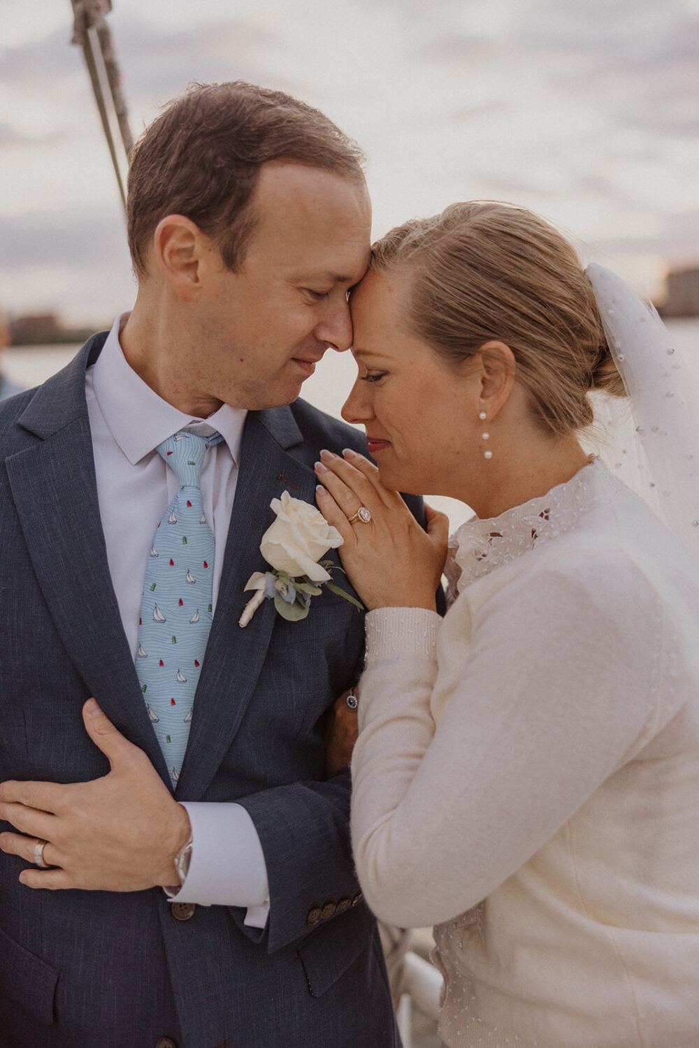 couple embrace during boat wedding