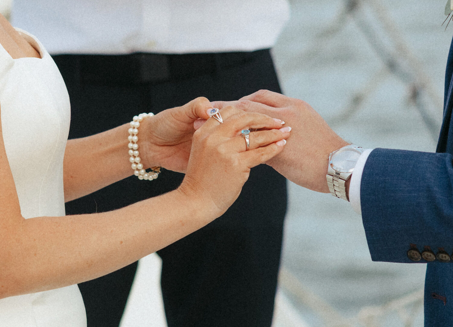couple exchanging wedding rings during boat wedding ceremony
