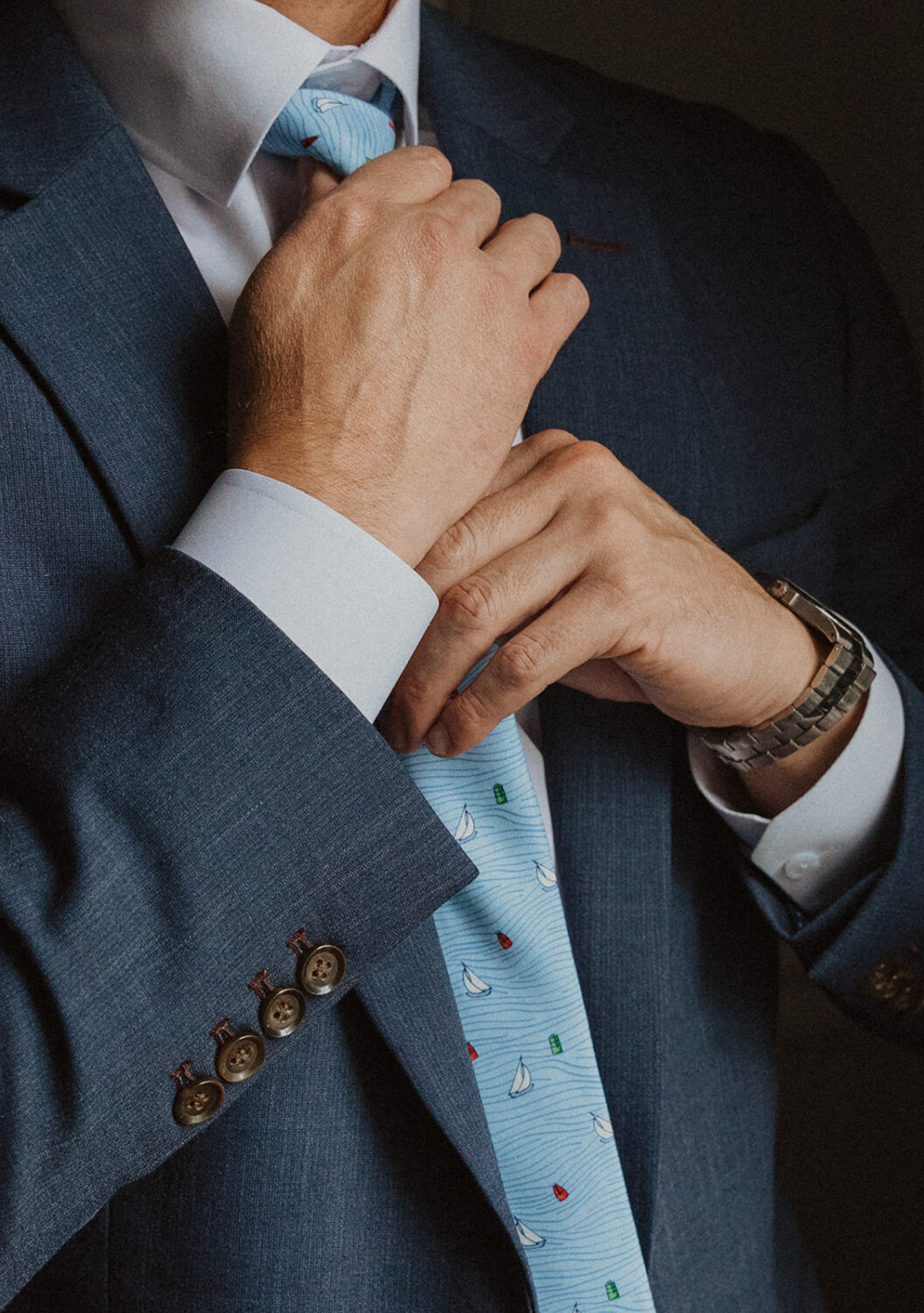 detail shot of groom's sailboat themed tie