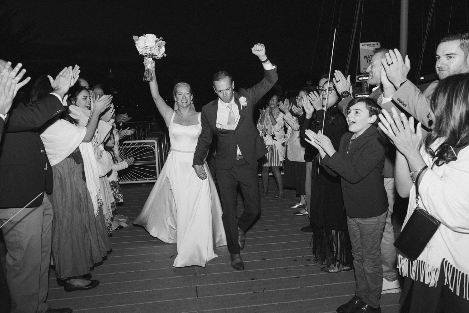 couple celebrate after boat wedding ceremony