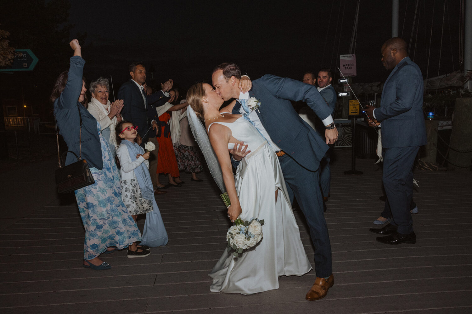 couple celebrate after boat wedding ceremony