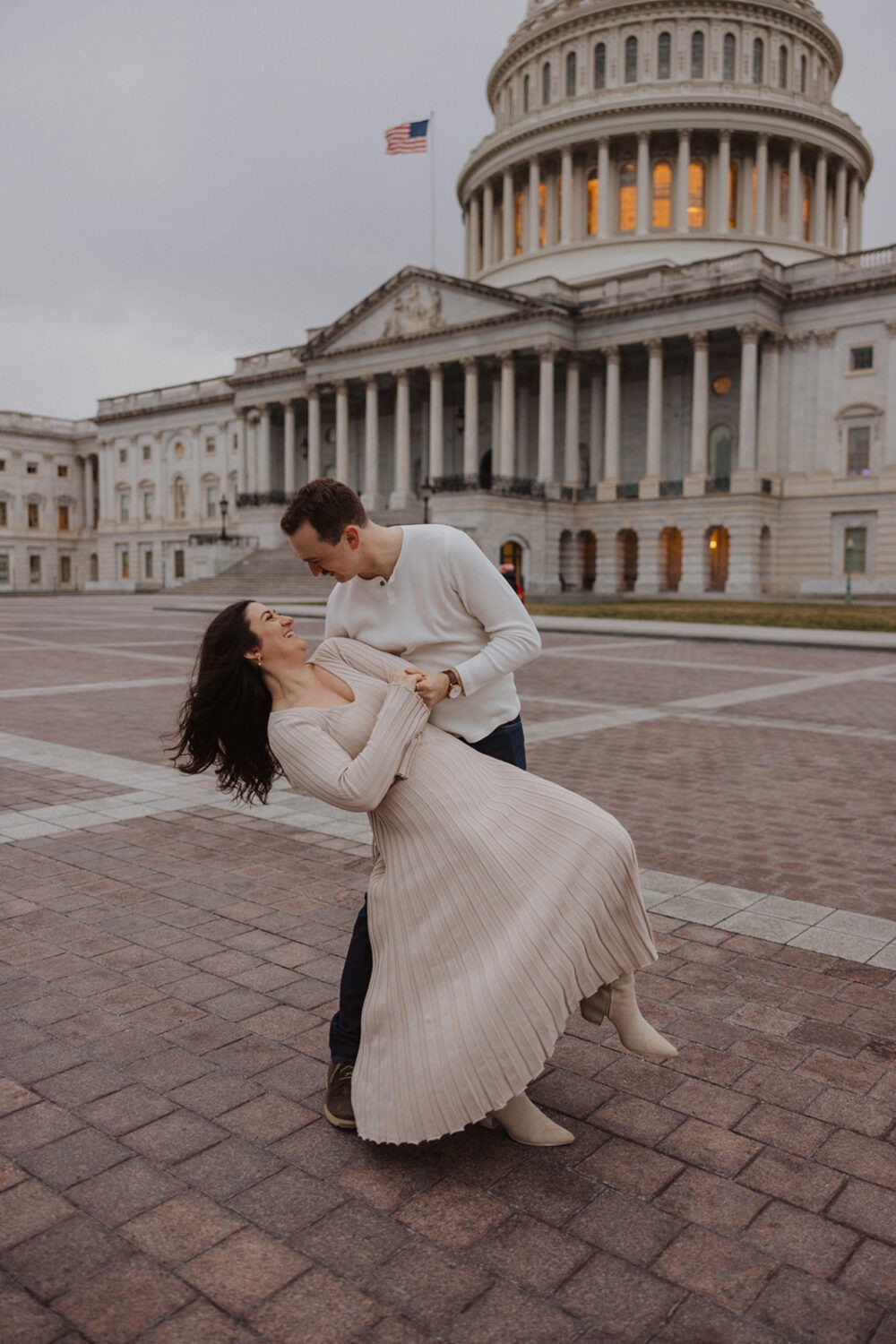 couple pose in front of Capitol Hill DC building