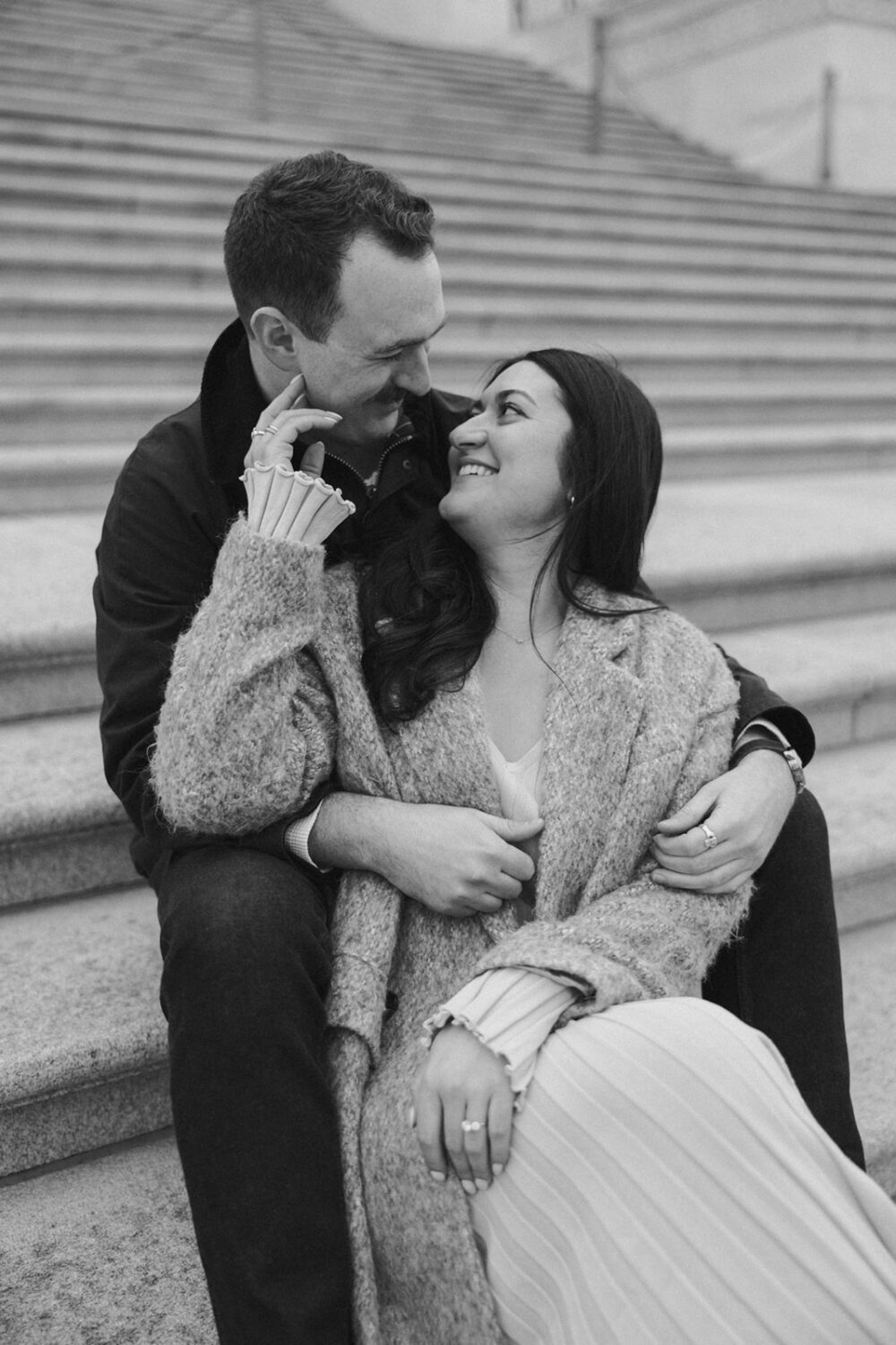 couple embrace on the steps of Capitol Hill DC