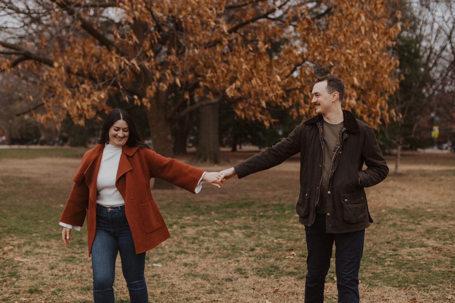 couple walking holding hands in Lincoln Park