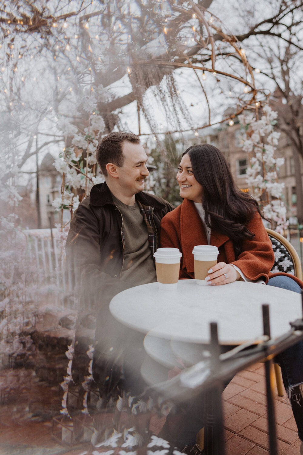 couple talking while sitting drinking coffee 