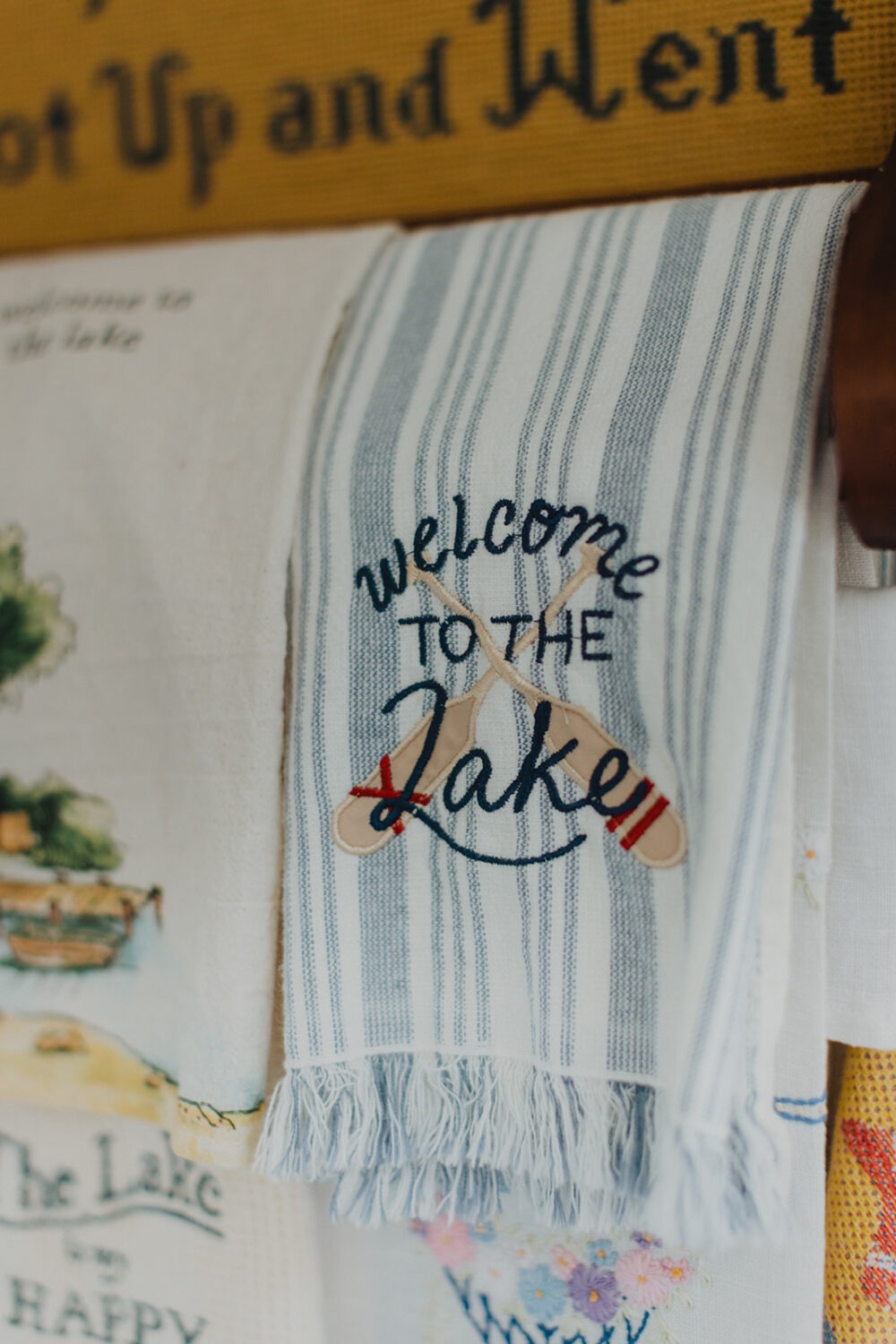 detail shot of a towel in the lake house that reads "welcome to the lake"