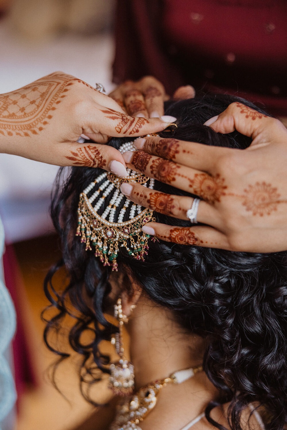 detail shot of bridal hair piece and henna tattoos