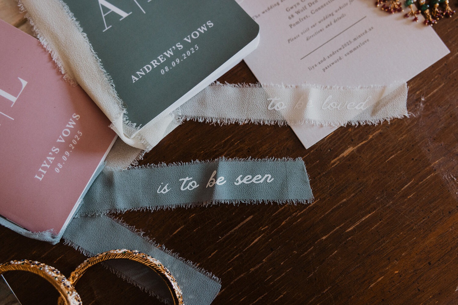 wedding lay details including vow books and ribbons