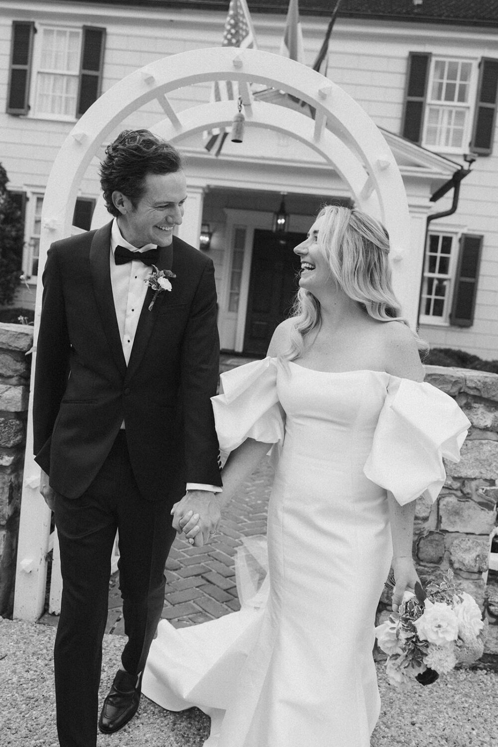 The Inn at Little Washington photos of the couple walking and holding hands under arbor