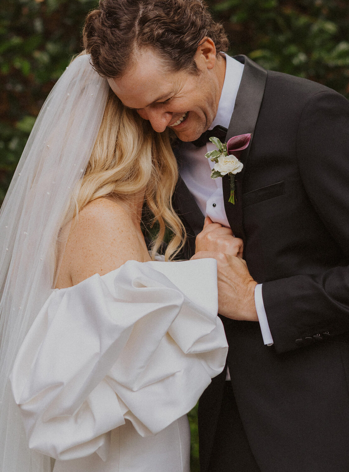 close up of couple embracing and smiling together