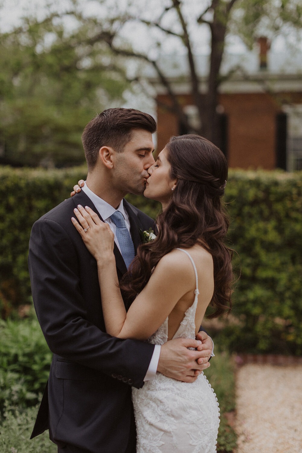 couple kissing in the courtyard for The Inn at Little Washington photos