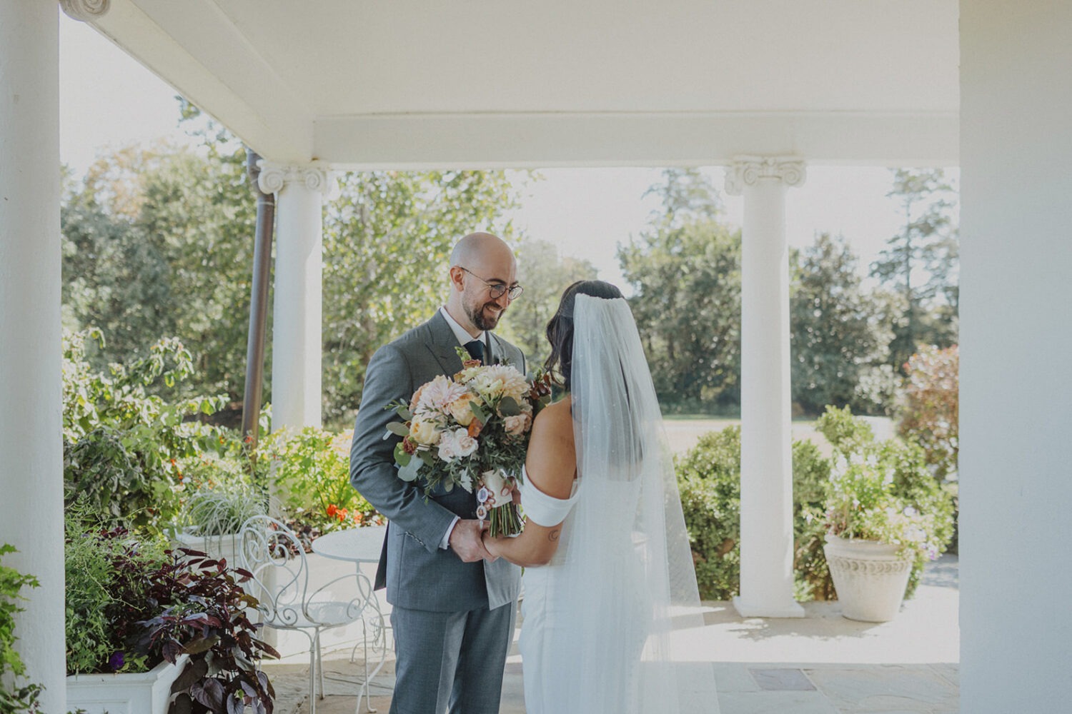 couple holding hands after first look at River Farm Alexandria Virginia