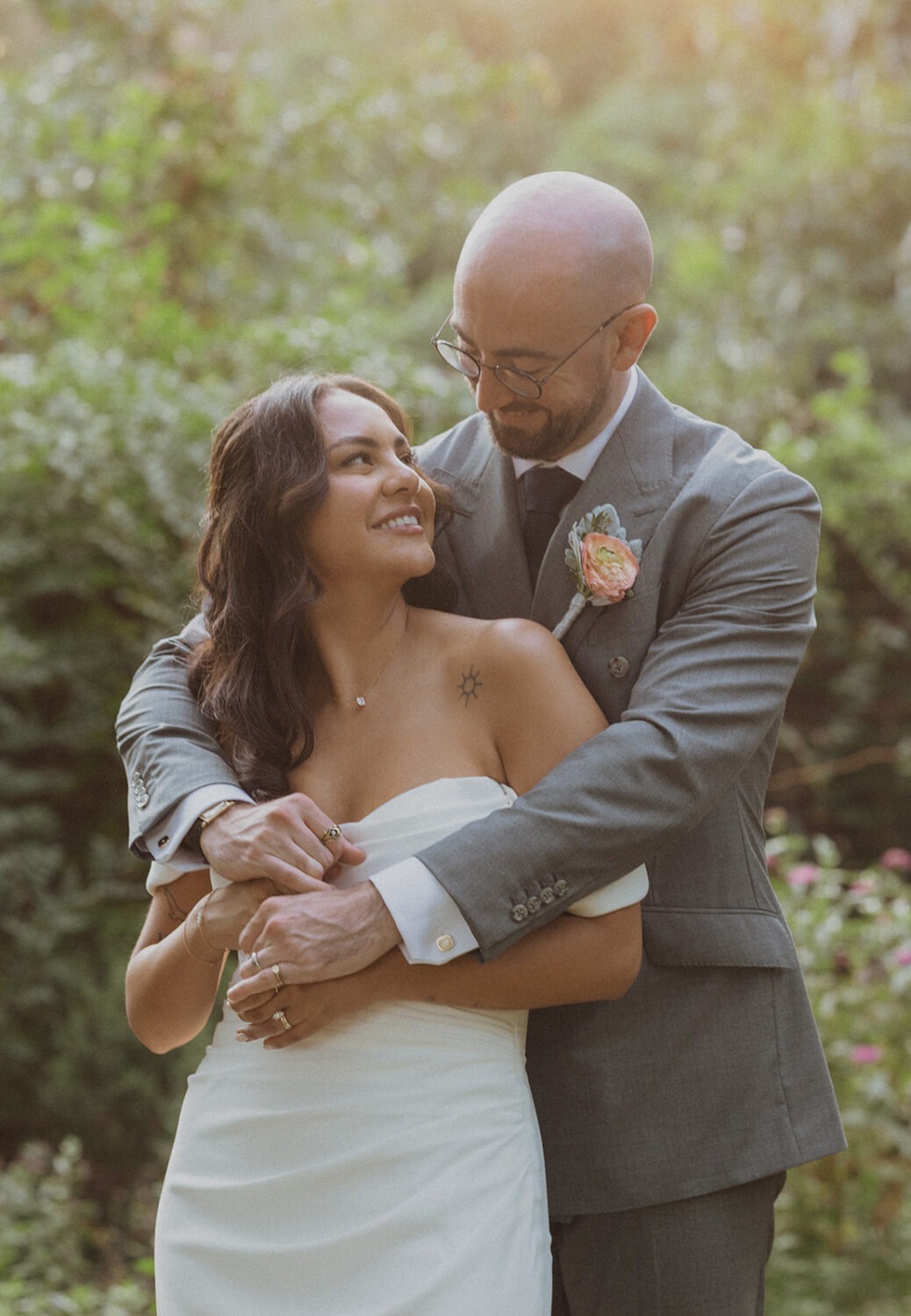 couple embrace during sunset at River Farm Alexandria Virginia