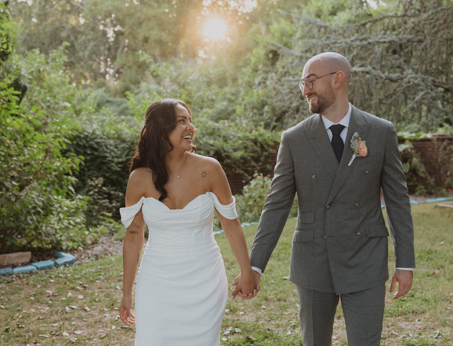 couple walking and holding hands during sunset at River Farm Alexandria Virginia