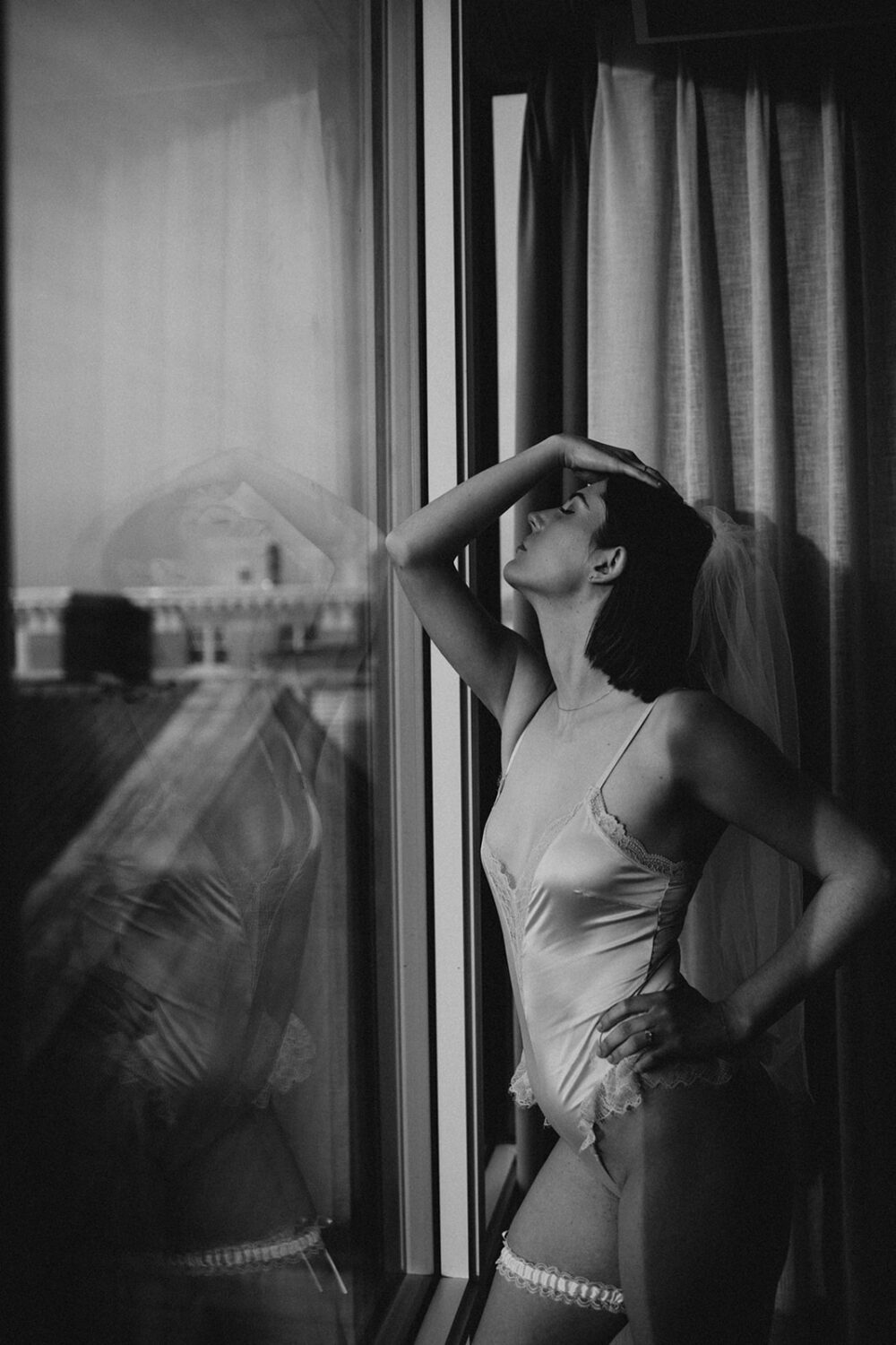 bridal boudoir of woman wearing white veil